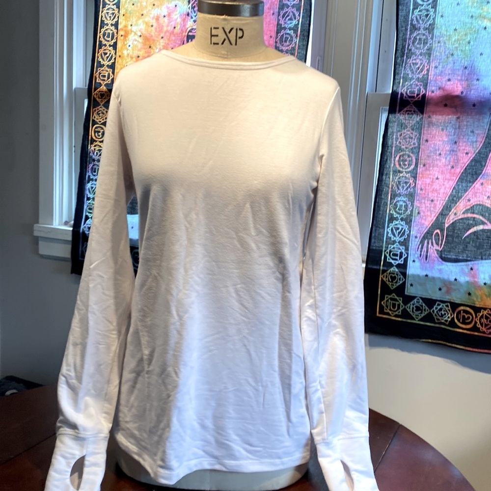 White long sleeve t shirt with thumb holes and lace back. Slim fitted.